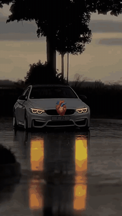 Car With Heart On Front Driving On Wet Road GIF