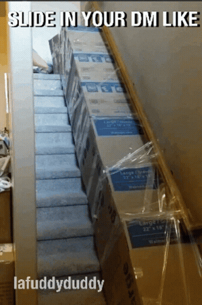 Cardboard Boxes Stacked On Stairs GIF