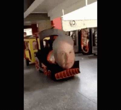 Cardboard Train With Face In Parking Garage GIF