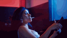 Cardi B Holding A Gun GIF