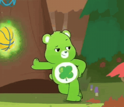 Care Bear With Clover Standing On One Leg In Front Of Tree GIF