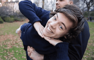 Carrying Another Man On Back Smiling GIF