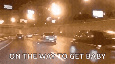 Cars Driving Down Highway At Night On The Way To Get Baby GIF