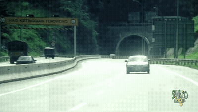 Cars Driving Down Highway With Sign Saying Had Ketinggian Terowong GIF