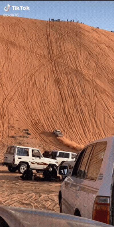 Cars Driving Down Sand Dune GIF