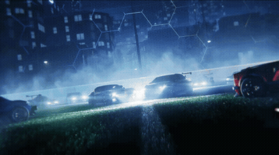 Cars Racing Down Track At Night GIF