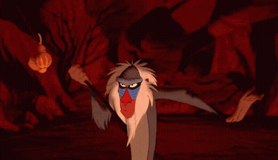 Cartoon Baboon Standing Next To Hyena In Cave GIF