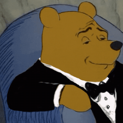 Cartoon Bear In Tuxedo And Bow Tie Sitting In Chair GIF