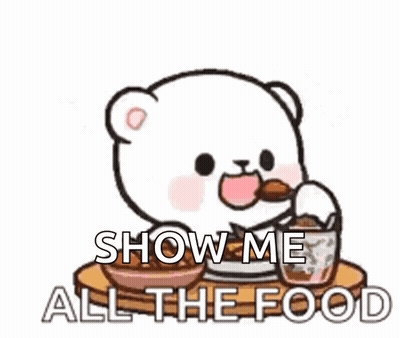 Cartoon Bear Sitting At Table Saying Show Me All The Food GIF