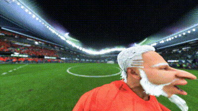 Cartoon Bearded Man In Red Shirt On Soccer Field GIF