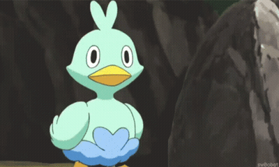 Cartoon Bird With Yellow Beak Standing In Front Of Rock GIF