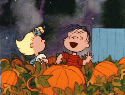 Cartoon Boy And Girl Standing Next To Pumpkins GIF