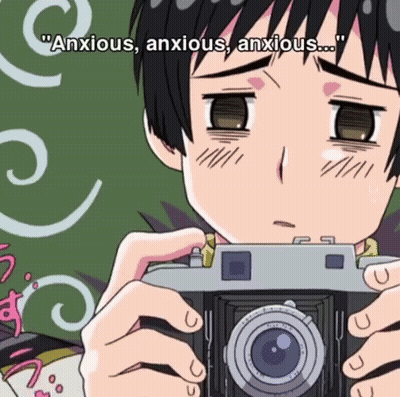 Cartoon Boy Holding Camera Saying Anxious Anxious Anxious GIF