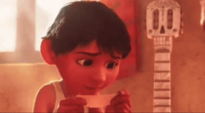 Cartoon Boy Holding Paper In Front Of Guitar GIF