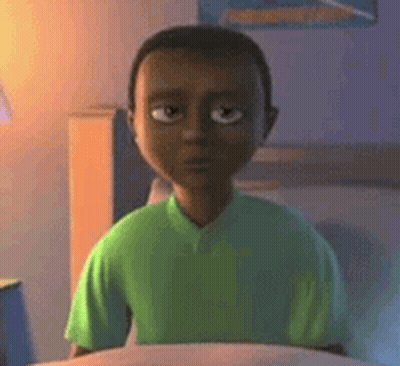 Cartoon Boy In Green Shirt On Bed Looking At Camera GIF