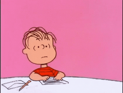 Cartoon Boy Sitting At Table With Pen And Paper GIF