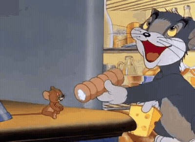 Cartoon Cat Holding Sausage Roll And Cheese While Mouse Looks On GIF