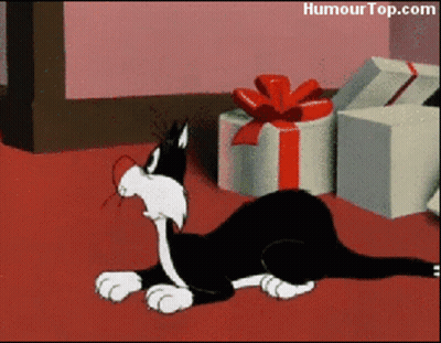 Cartoon Cat Laying By Gifts GIF