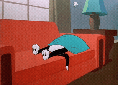 Cartoon Cat Laying On Red Couch With Blue Pillow GIF