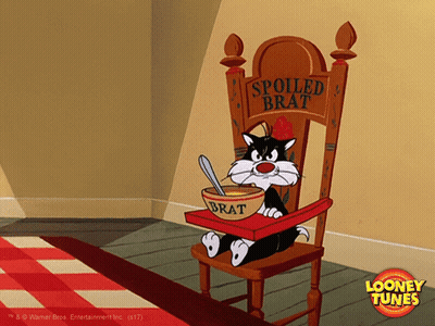 Cartoon Cat Sitting In High Chair With Bowl Of Brat GIF