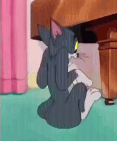Cartoon Cat Sitting Under Table GIF