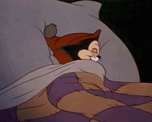 Cartoon Cat Sleeping In Bed With Purple Blanket GIF