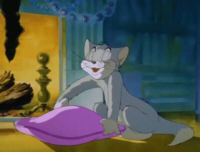 Cartoon Cat Smiling Holding Purple Pillow GIF