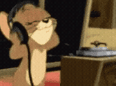 Cartoon Cat Wearing Headphones At Computer GIF