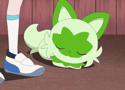 Cartoon Cat With Green Leaves Laying On Floor GIF