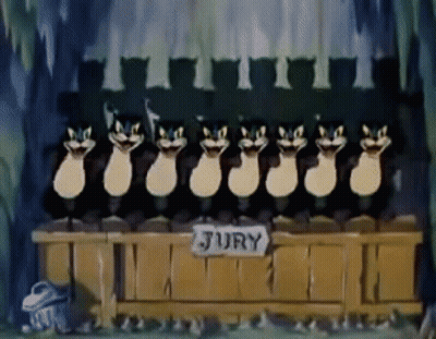 Cartoon Cats Sitting In Front Of Jury Table GIF