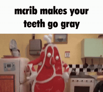 Cartoon Character Dressed As Meat In Kitchen GIF