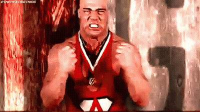 Cartoon Character Flexing Muscles With Heart On Belt GIF