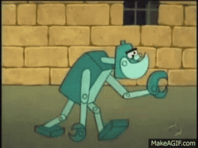 Cartoon Character Holding Glove In Front Of Brick Wall GIF