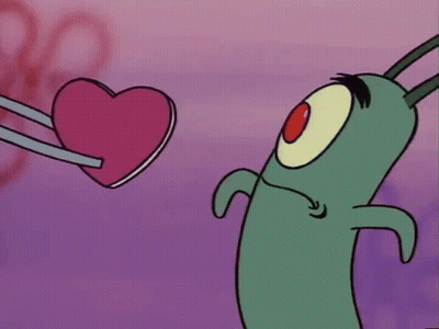 Cartoon Character Holding Pink Heart GIF