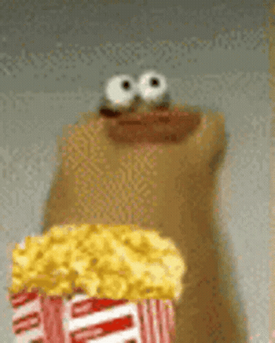 Cartoon Character Holding Popcorn And Donut GIF