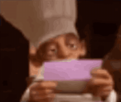 Cartoon Character Holding Purple Card GIF
