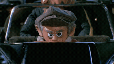 Cartoon Character In Car With Hat GIF