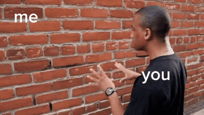 Cartoon Character In Front Of Brick Wall GIF