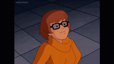 Cartoon Character In Glasses And Orange Sweater Looking Up GIF