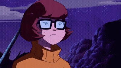 Cartoon Character In Glasses And Yellow Sweater Under Purple Sky GIF