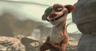 Cartoon Character In Green Hat Smiling Beside Rock GIF