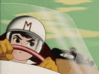 Cartoon Character In Helmet With M Driving Race Car GIF