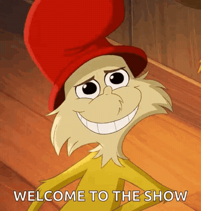 Cartoon Character In Red Hat Smiling Says Welcome To The Show GIF