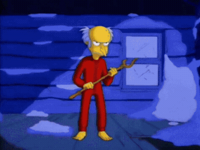 Cartoon Character In Red Pajamas Holding A Stick GIF