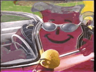 Cartoon Character In Sunglasses Sitting In Car Holding Lemon GIF