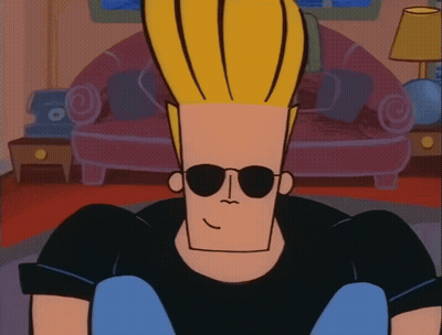 Cartoon Character In Sunglasses Sitting In Living Room GIF