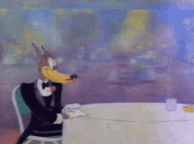 Cartoon Character In Tuxedo Sitting GIF
