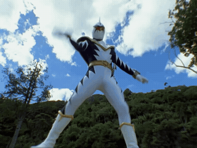 Cartoon Character In White And Black Outfit Standing In Front Of Trees GIF