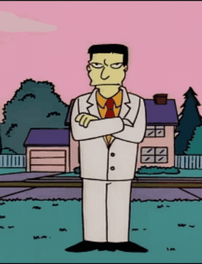 Cartoon Character In White Suit And Tie In Front Of House GIF