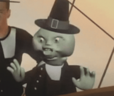Cartoon Character In Witch Hat And Overalls Beside Man GIF